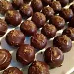 Decadent Pecan Pie Balls with a rich, nutty filling and chocolate coating, perfect for dessert.