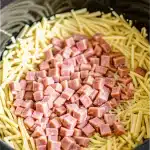 Slow-cooked Crockpot Ham and Potato Casserole, a satisfying and easy-to-make dinner recipe.