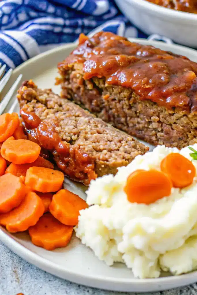 Delicious Meatloaf With A Tomato Beef Sauce, made with ground beef and a tangy tomato glaze.