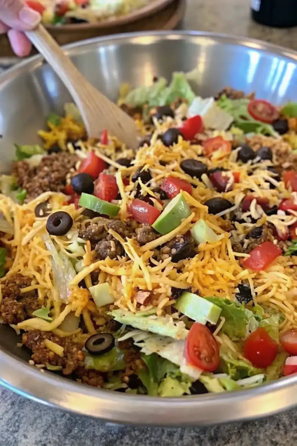 Classic Taco Salad, a hearty and fresh dish topped with your favorite taco fixings.